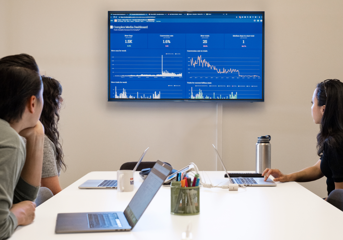 People working with charts and analytic tools