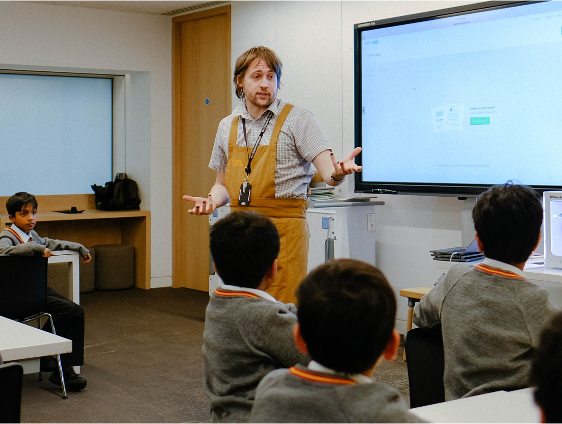 Teacher teaching students how to use Marvel Prototyping